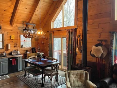 Dining and coffee station area, fireplace, outside sliding doors, is the hot tub