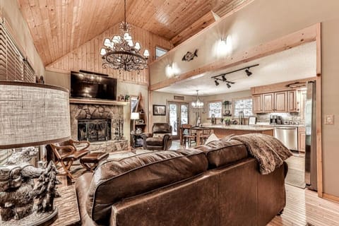 Enter the living space and begin to relax.  Plush furniture for your comfort. Wood-burning fireplace, open concept living for maximum interaction while dining, cooking, eating or just enjoying each other`s company.