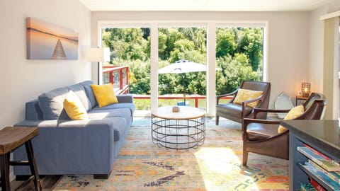 Riverfront sunroom with floor to ceiling windows. 