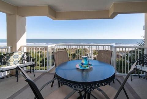 Sipping coffee, savoring the ocean view from the balcony.