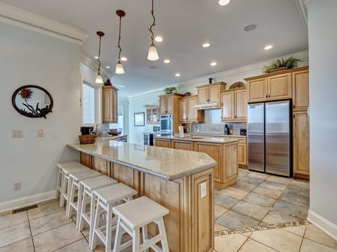 The spacious kitchen with countertop seating for 6
