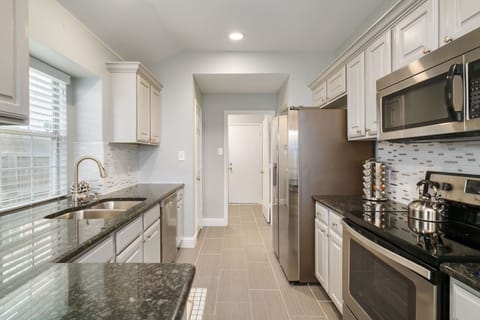 Fully stocked kitchen with full size fridge with Icemaker