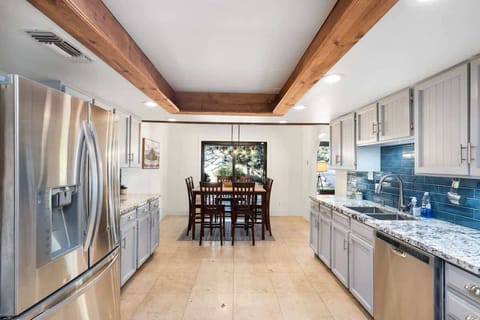 Stainless steel appliances and open floorplan make it easy to navigate during meal time