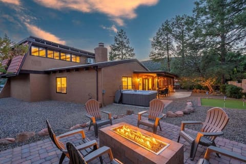 Beautiful backyard with gas firepit, putting green, and hot tub to keep you entertained
