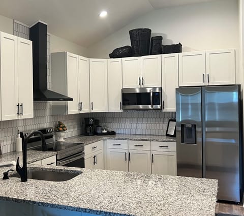 The kitchen features Samsung appliances. We are well-stocked with all you need!