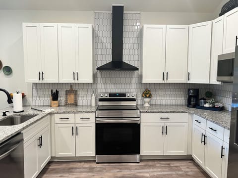 Ample plates, cookware, glasses, wine glasses, and spices!