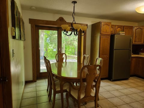 Dining room table has a leaf and two extra chairs to seat 8
Door to back deck