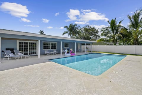 A view of the pool and house from the backyard.