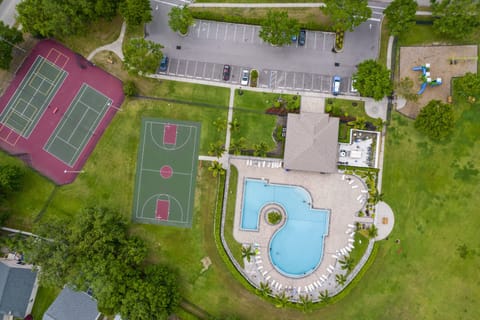 Step outside the gate and you've got it all — pool, basketball, tennis, and pickleball waiting.