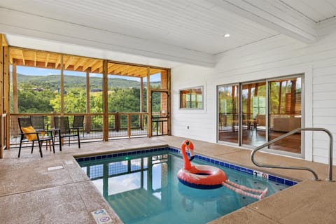 The indoor pool is heated to 86 degrees year round. During the winter months, clear vinyl panels are installed over the screened areas to help retain the warmth and maintain a comfortable swimming environment.
