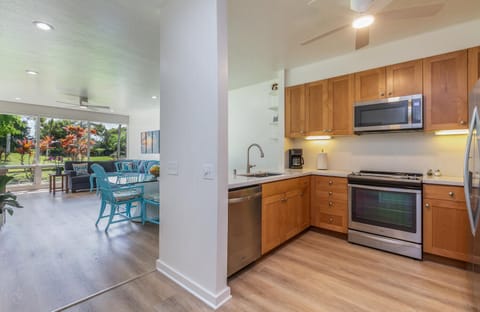 Kitchen overlooks dining and living areas
