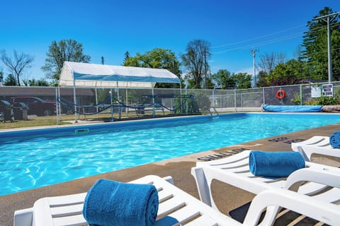 Seasonal outdoor pool, open 8:00 AM to 9:00 PM, pool umbrellas