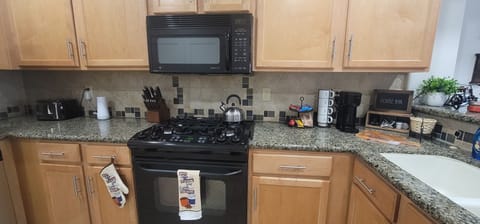 Kitchen - Granite countertops and stove and microwave.