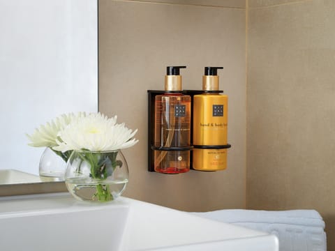 Shower, rainfall showerhead, designer toiletries, hair dryer