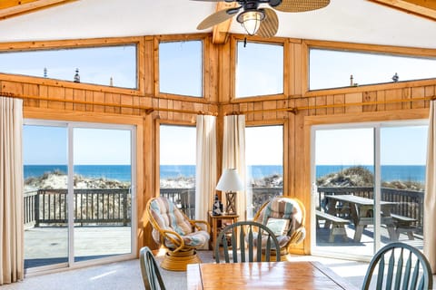 Relax in the spacious Living Area that is surrounded by large windows that let in all the glorious light of the Outer Banks sunshine.