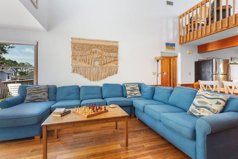 Relax in the open-air Living Area with Flat Screen TV for family movie night.