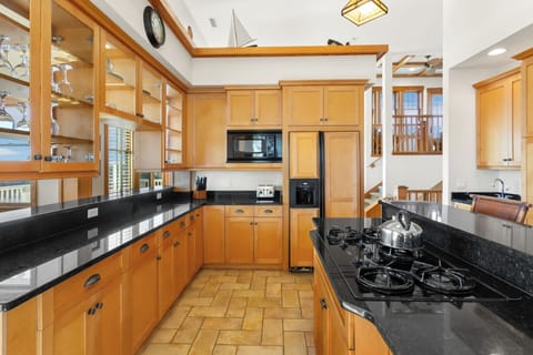 Whip up a delicious meal of fresh, local seafood in the gorgeous Kitchen with granite countertop, dual ovens, 2 dishwashers, and a Breakfast Bar with seating for 3.