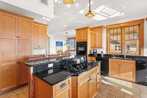 Whip up a delicious meal of fresh, local seafood in the gorgeous Kitchen with granite countertop, dual ovens, 2 dishwashers, and a Breakfast Bar with seating for 3.