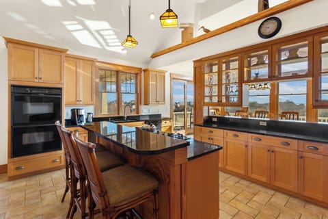 Whip up a delicious meal of fresh, local seafood in the gorgeous Kitchen with granite countertop, dual ovens, 2 dishwashers, and a Breakfast Bar with seating for 3.