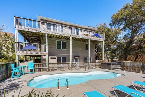 Relax in the bubbly hot tub while enjoying the serene natural surroundings.