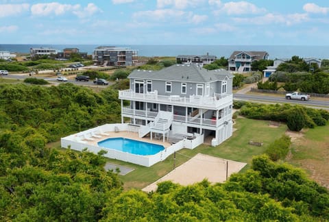 Welcome to Latitude Adjustment! A 6-bedroom, semi-oceanfront home just steps to the sea!