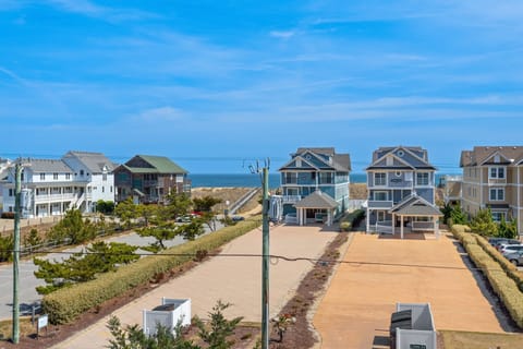 The large covered top-level deck offers beautiful ocean views.
