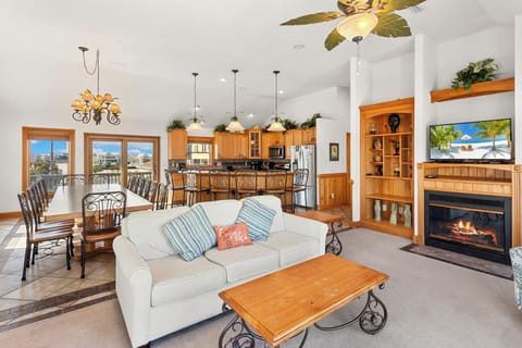 Enjoy perfect serenity with style and comfort in the expansive Top-Level Living Area with high ceilings and a Flat Screen TV.