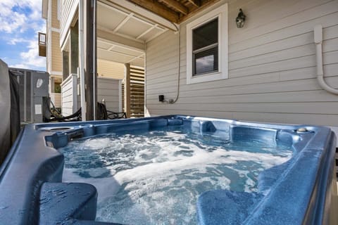 Unwind in the private hot tub as you relax under the coastal sky after a day at the beach.