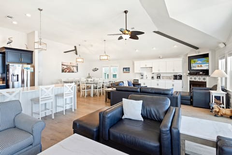 Beautifully appointed with an ocean of cozy furnishings, and a flat-screen TV with hook-ups/capabilities for iPod, video game consoles, and Netflix, the central living area is where families can unwind.