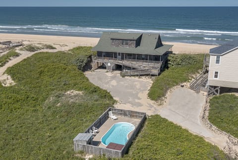 Rear exterior and private pool area.