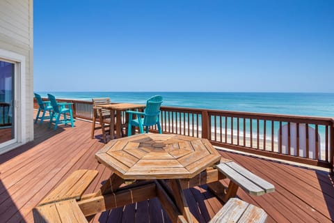 The oceanfront deck offers uninterrupted views of the Atlantic, making it the perfect spot for sunrise coffee or evening relaxation.