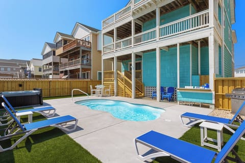 Relax out back by the pool at Mint Julep for an unforgettable Outer Banks vacation!