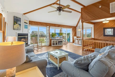 Top-Level Living Area: Bright and open with plenty of seating and sliding doors to sun decks.
