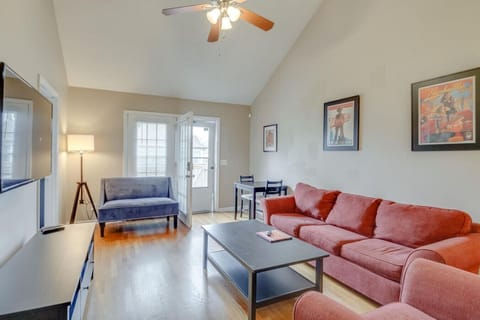 Bright living room with vaulted ceilings and a cozy sofa.