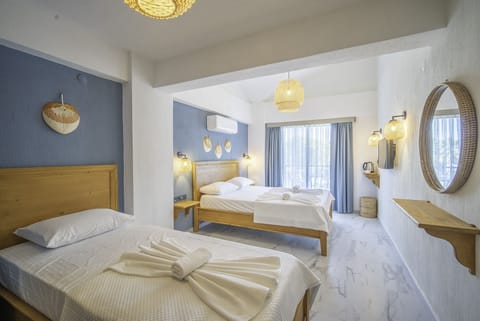 Standard Triple Room | Premium bedding, minibar, in-room safe, blackout drapes