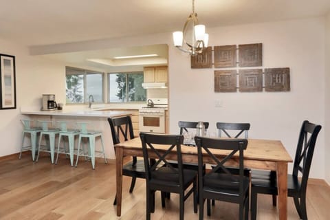 With seating for four at the peninsula bar and a dining table for 6 tucked away under a modern chandelier, there’s room for the entire group to enjoy that meal together. 