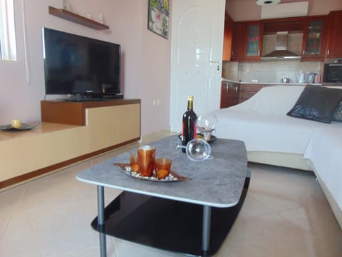Comfort House, 1 Bedroom, Balcony, Beachfront | Living room | 42-inch flat-screen TV with digital channels, TV, fireplace
