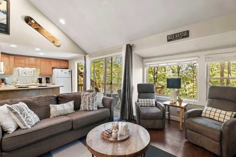 Embrace the living room with a view, where mountain vistas become the backdrop to your moments of relaxation. It's not just a room; it's your front-row seat to nature's grandeur.