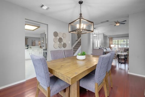 Spacious, fenced backyard with playset and seating makes Boni and Blithe ideal for families and pets.