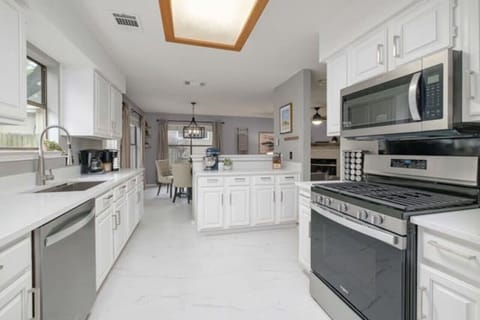 Bright, updated kitchen with stainless appliances and generous counter space for easy family meals or work trips.