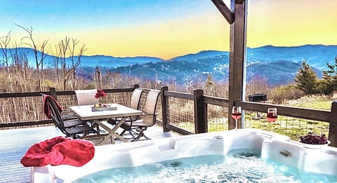 Hot Tub Retreat: Soak it up with stunning mountain views and evening sips on your private deck!