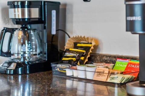 Coffee bar includes all the essentials for your morning brew including a 12 cup coffee maker, Keurig, and a starter pack of ground coffee, tea, K-cups, sweetener, and creamer.