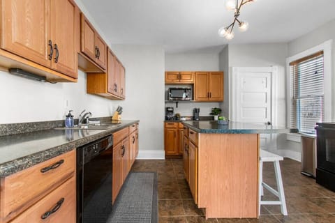 Island in the kitchen offers additional space for cooking and/or seating.