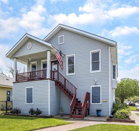 Check out the front of this amazing home! Stairs to front porch and main entrance.