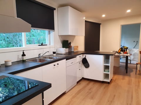 Full kitchen with smaller meals area