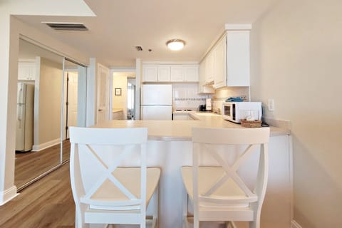 Kitchen bar countertop with 2 bar stools.