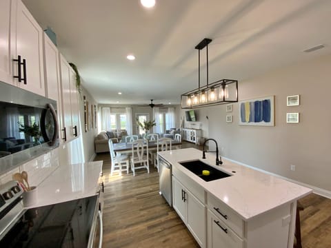 Kitchen and Dining Areas - Gorgeous quartz counters, solid surface flooring and stainless appliances.