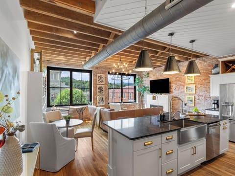 View of the open kitchen and living room from the hallway