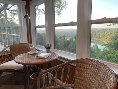 3 season room with sitting area and office desk. 