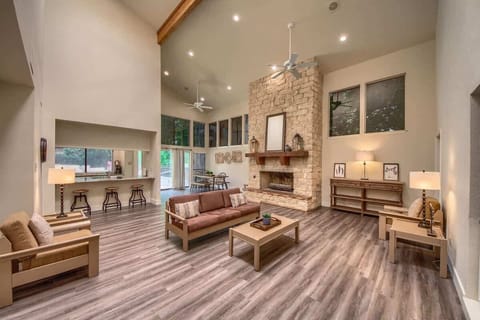 Living room with vaulted ceilings and a beautiful fireplace. 